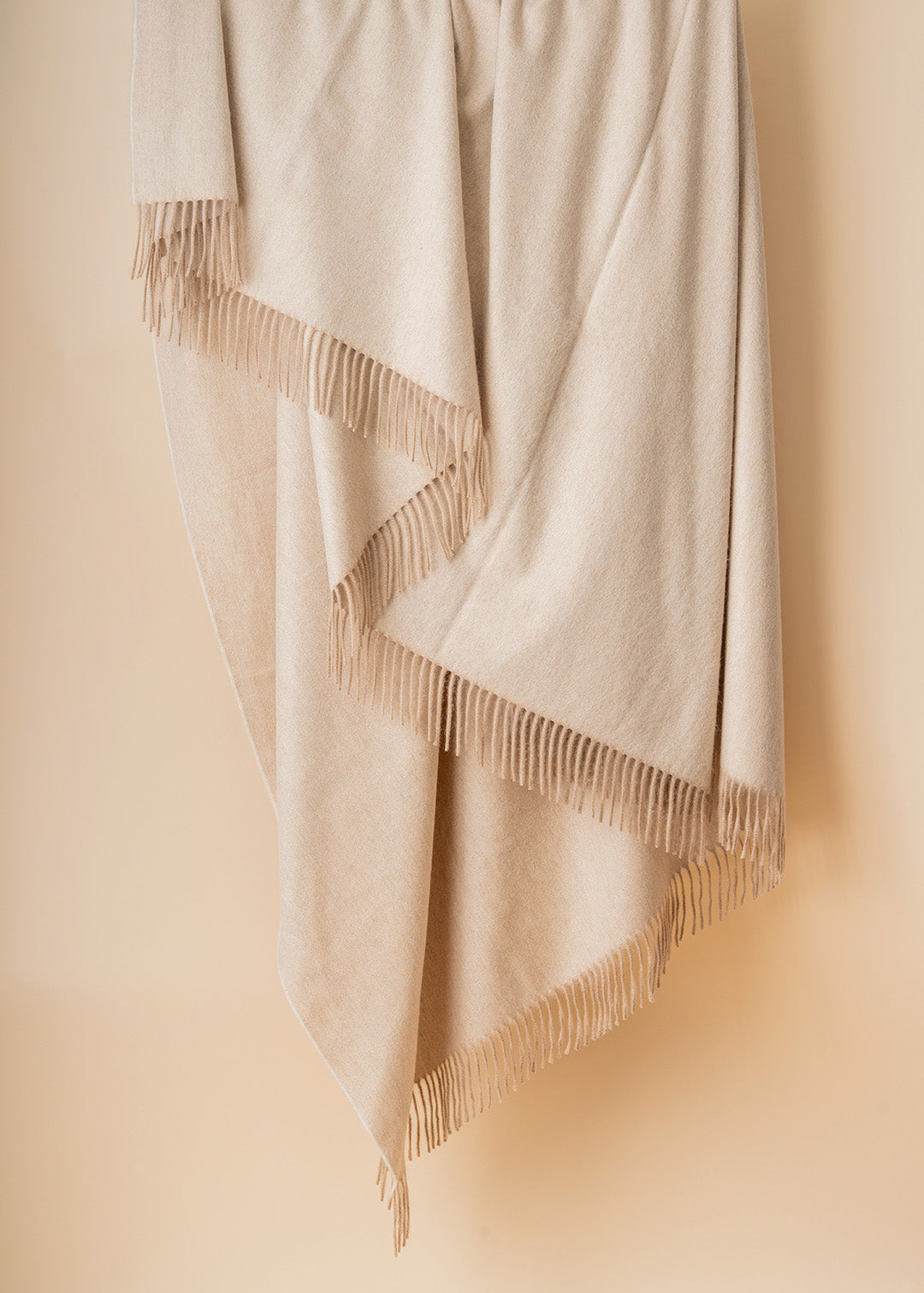 Pale sand cashmere throw.