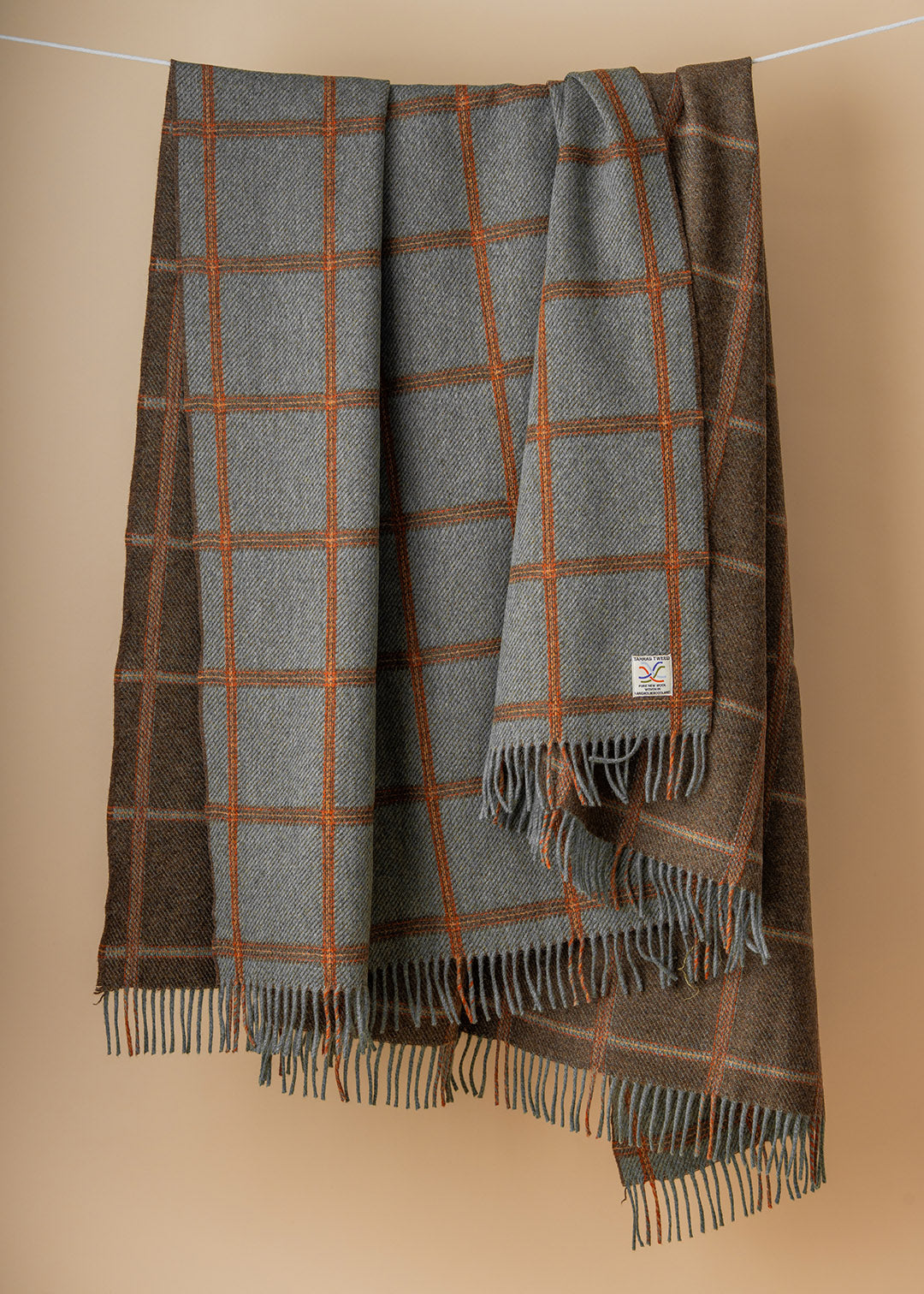 Reversible, checked wool throw in sea blue-green and brown.