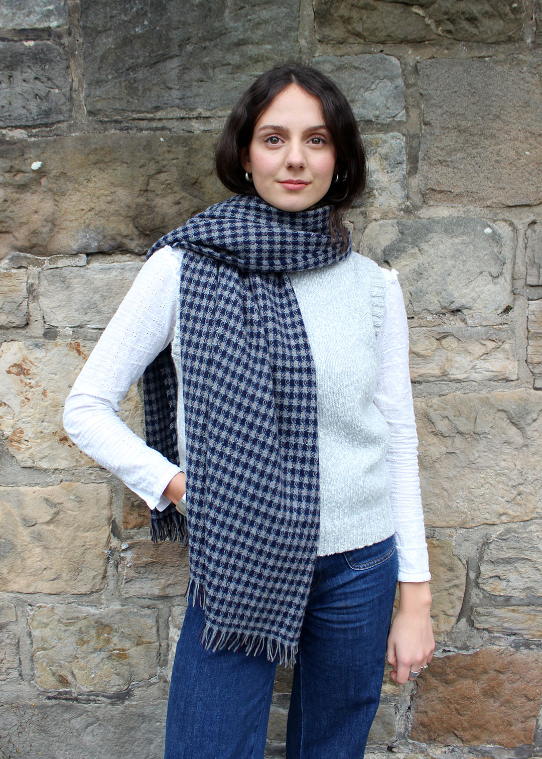 Woven cashmere scarf shown on model. Scottish Textiles Showcase.