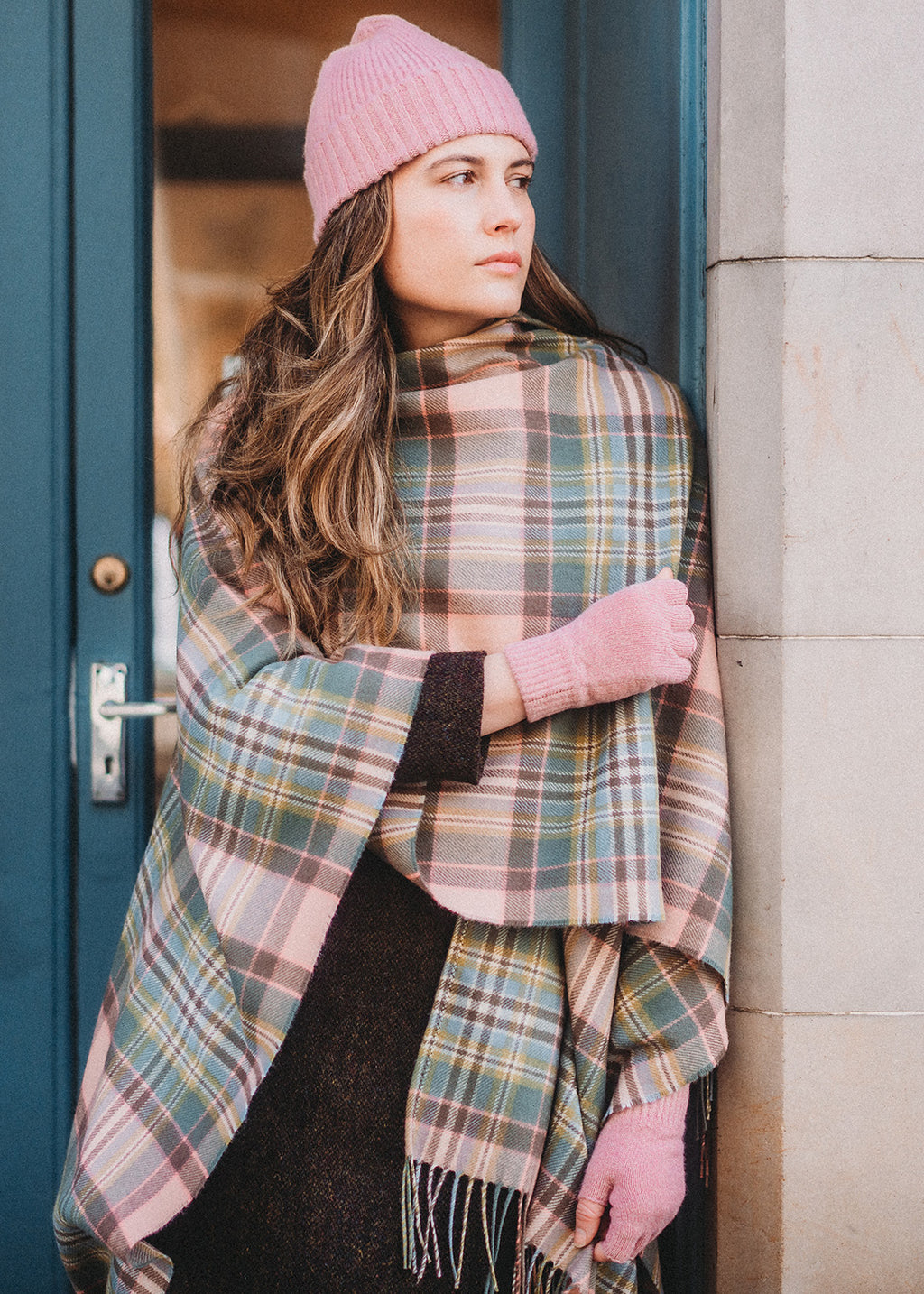 The Dundee Rose tartan serape is woven in a beautiful pastel colour palette featuring soft pink and mint green.