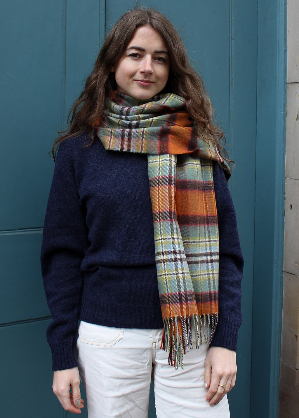 Lambswool tartan scarf in Dundee Old Weathered tartan shown on model.