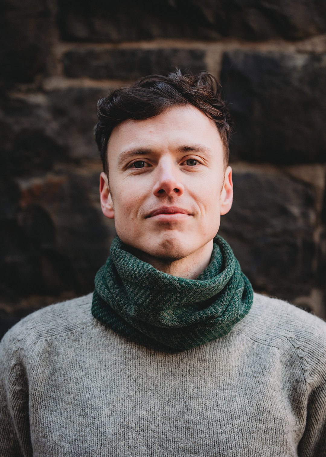 Lambswool knitted neck warmer shown on model.