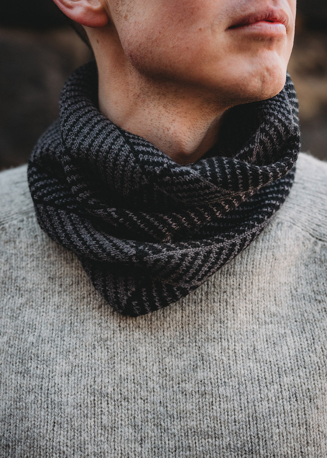 Lambswool knitted neck warmer shown on model.