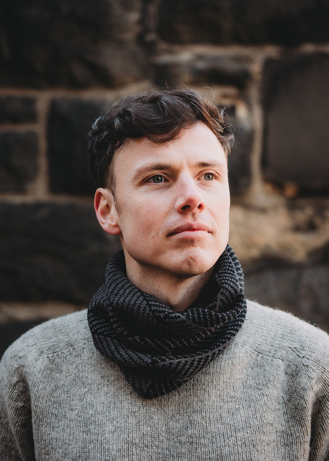 Lambswool knitted neck warmer shown on model.