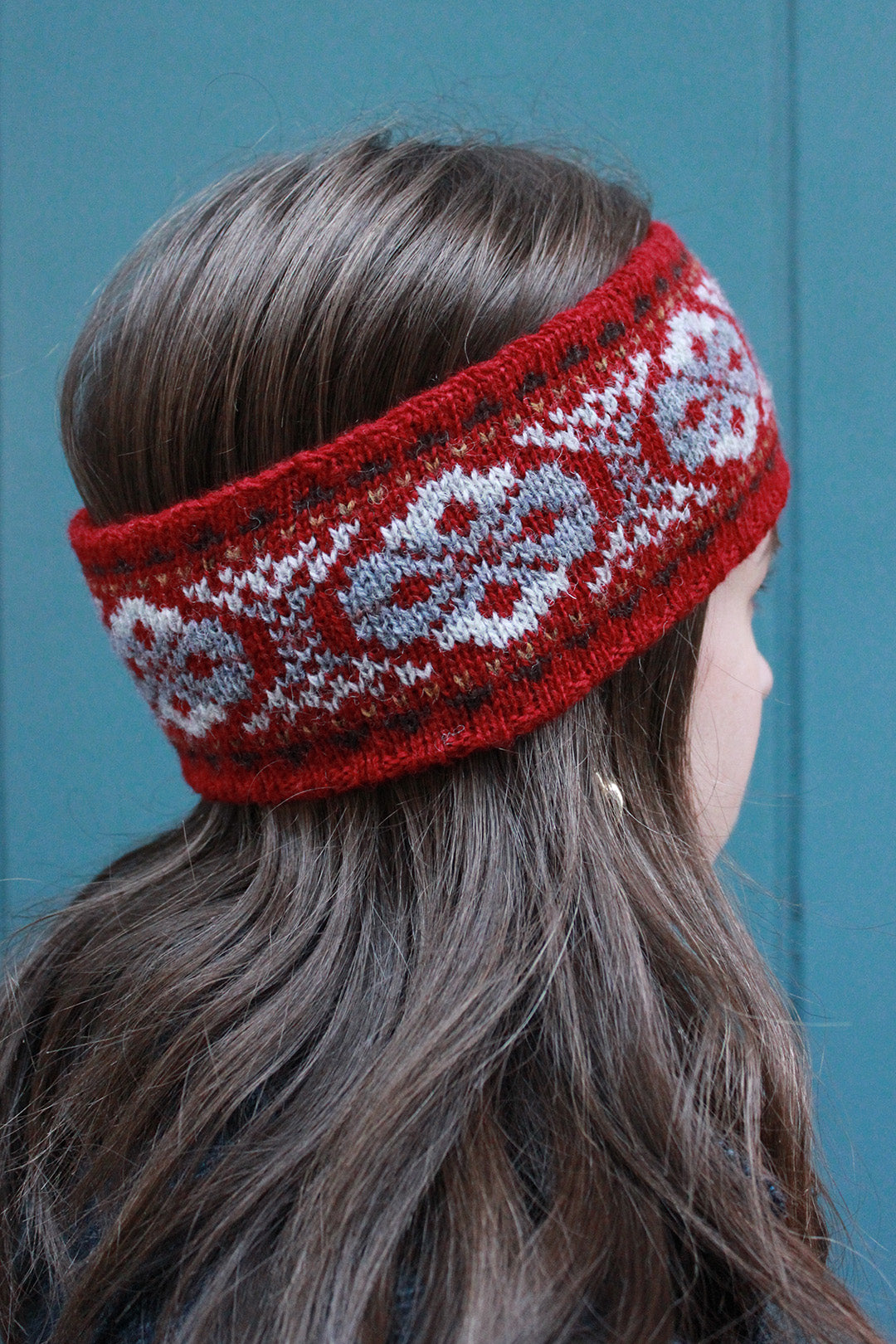 Hand knitted Fair Isle headband in shades of red, made exclusively for the Scottish Textiles Showcase.