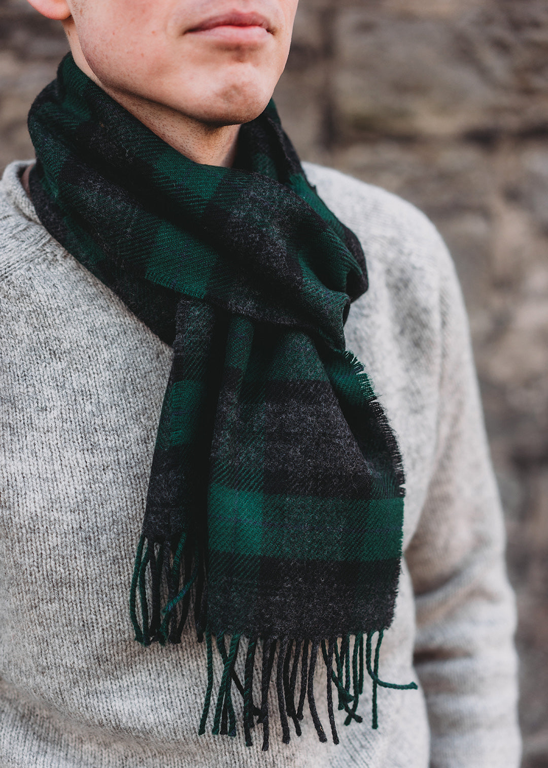 The Black Watch Hebridean scarf is woven in soft, brushed lambswool with classic greens and charcoal.