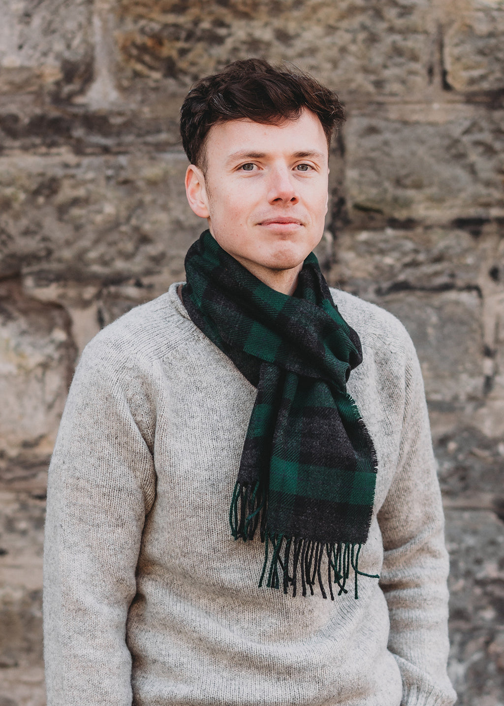 The Black Watch Hebridean scarf is woven in soft, brushed lambswool with classic greens and charcoal.