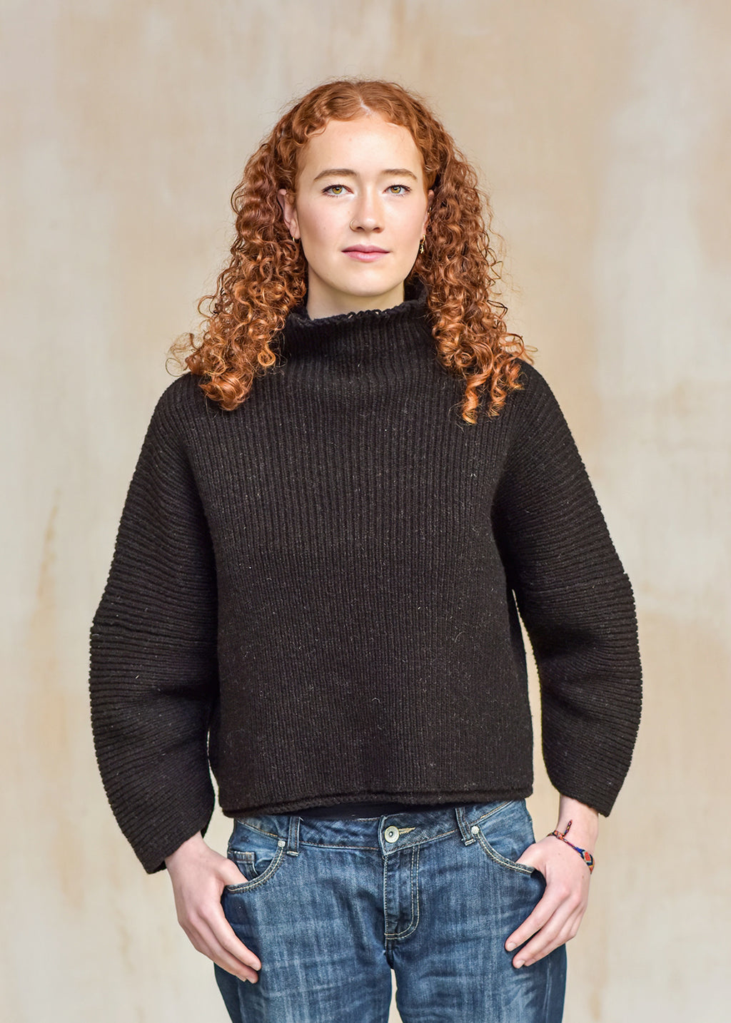 Luxury hand frame knitted jumper made with un-dyed, dark brown wool from Shetland sheep.
