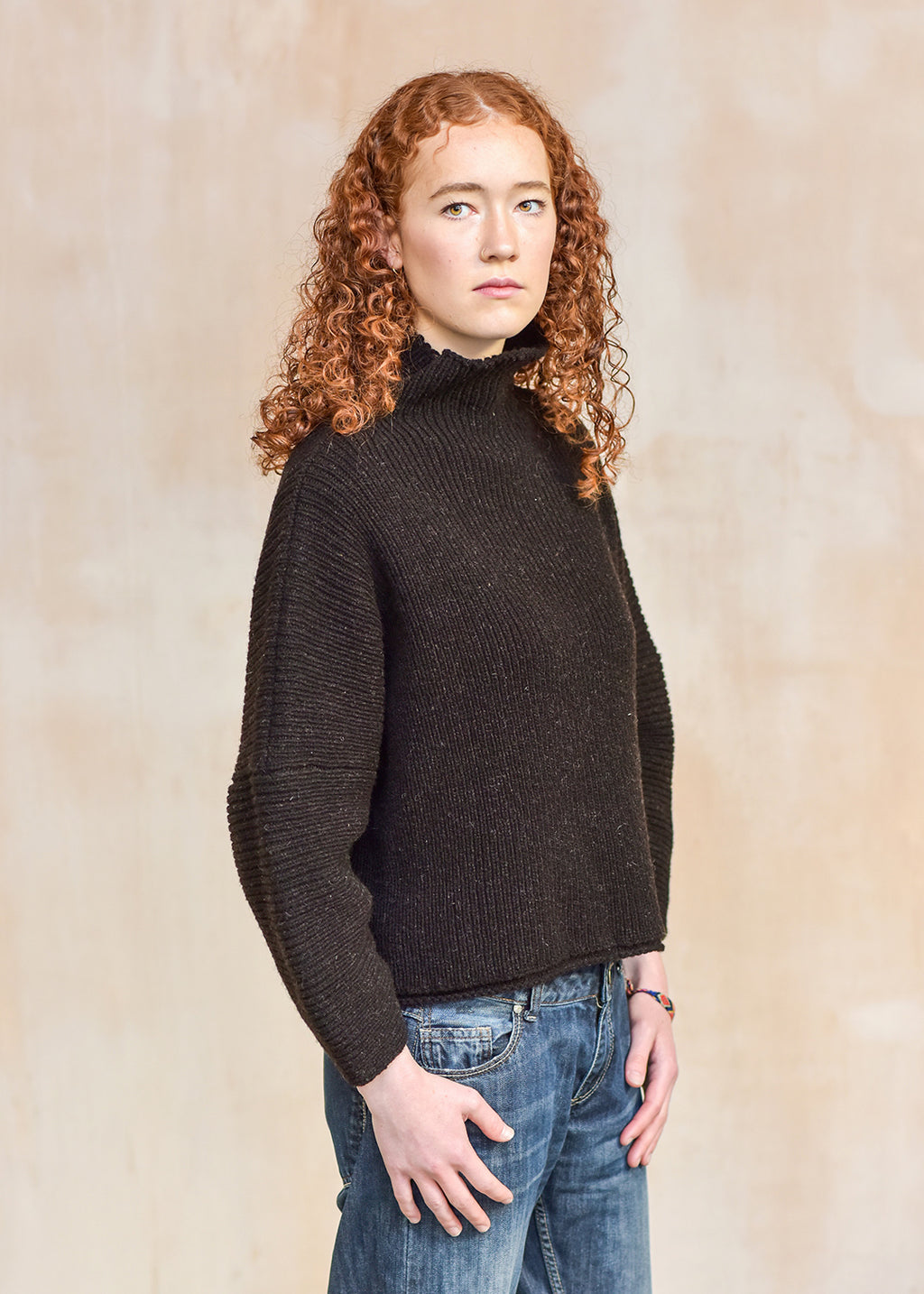 Luxury hand frame knitted jumper made with un-dyed, dark brown wool from Shetland sheep.