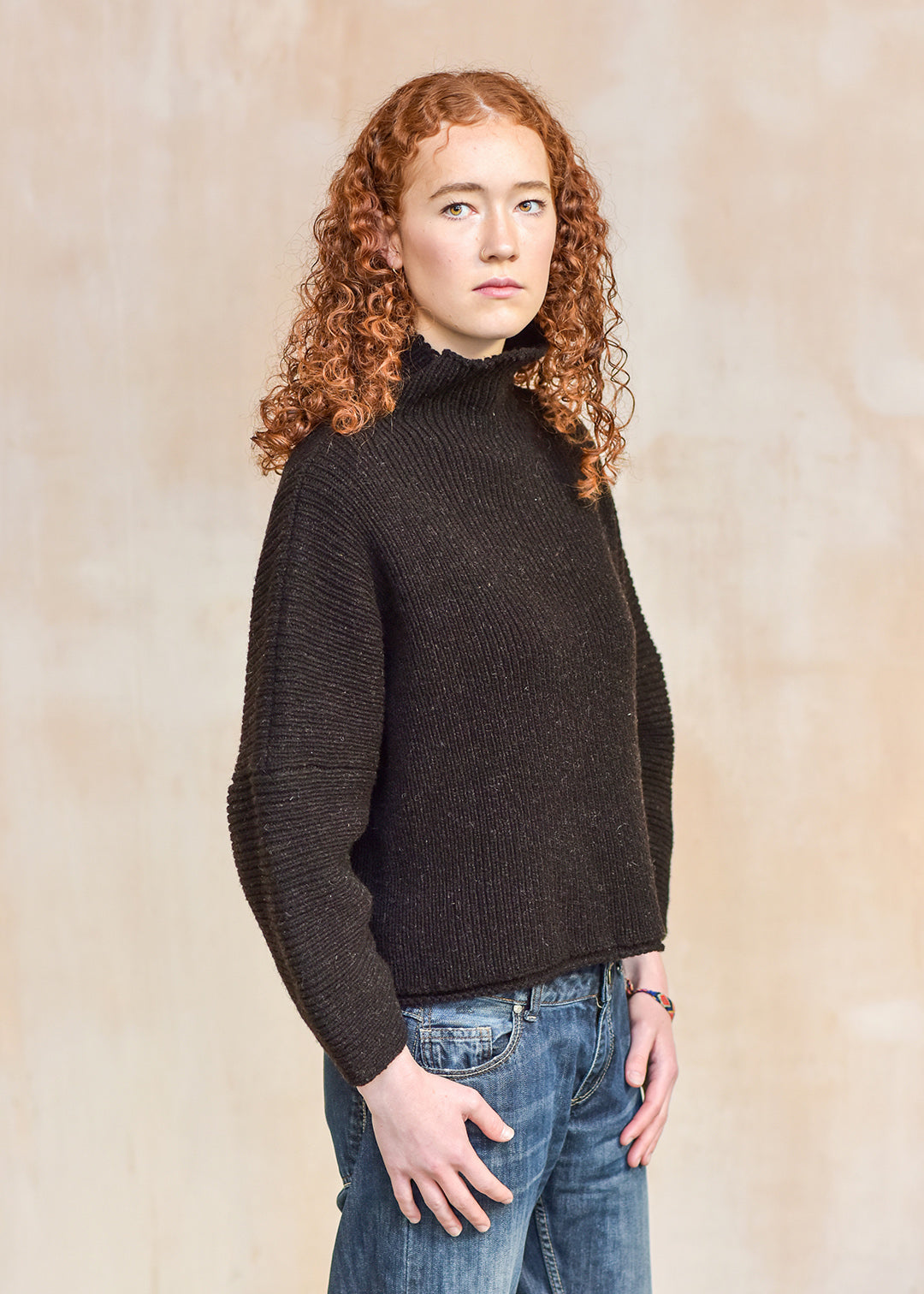 Luxury hand frame knitted jumper made with un-dyed, dark brown wool from Shetland sheep.