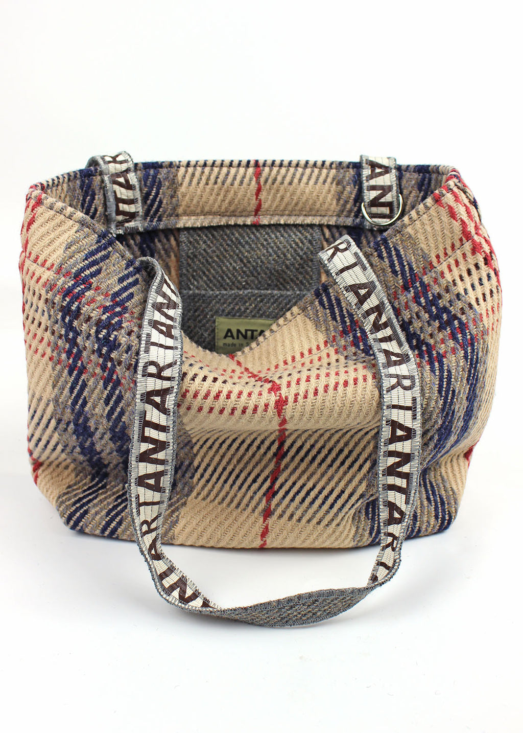 Wool carpet bag woven in peach, blue, pink and grey.