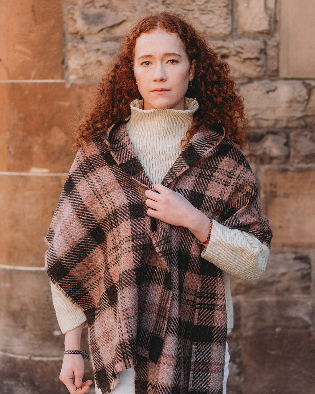 Classic checked scarf woven with 100% British wool in shades of pink and brown.
