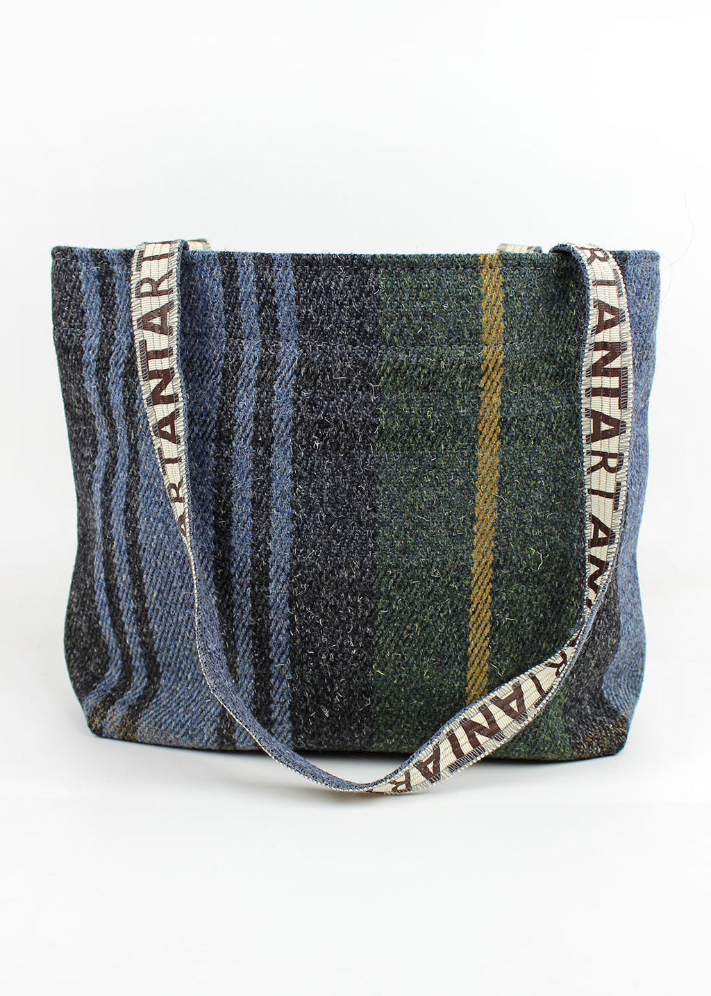 Wool carpet bag woven in green, blue, black and yellow.