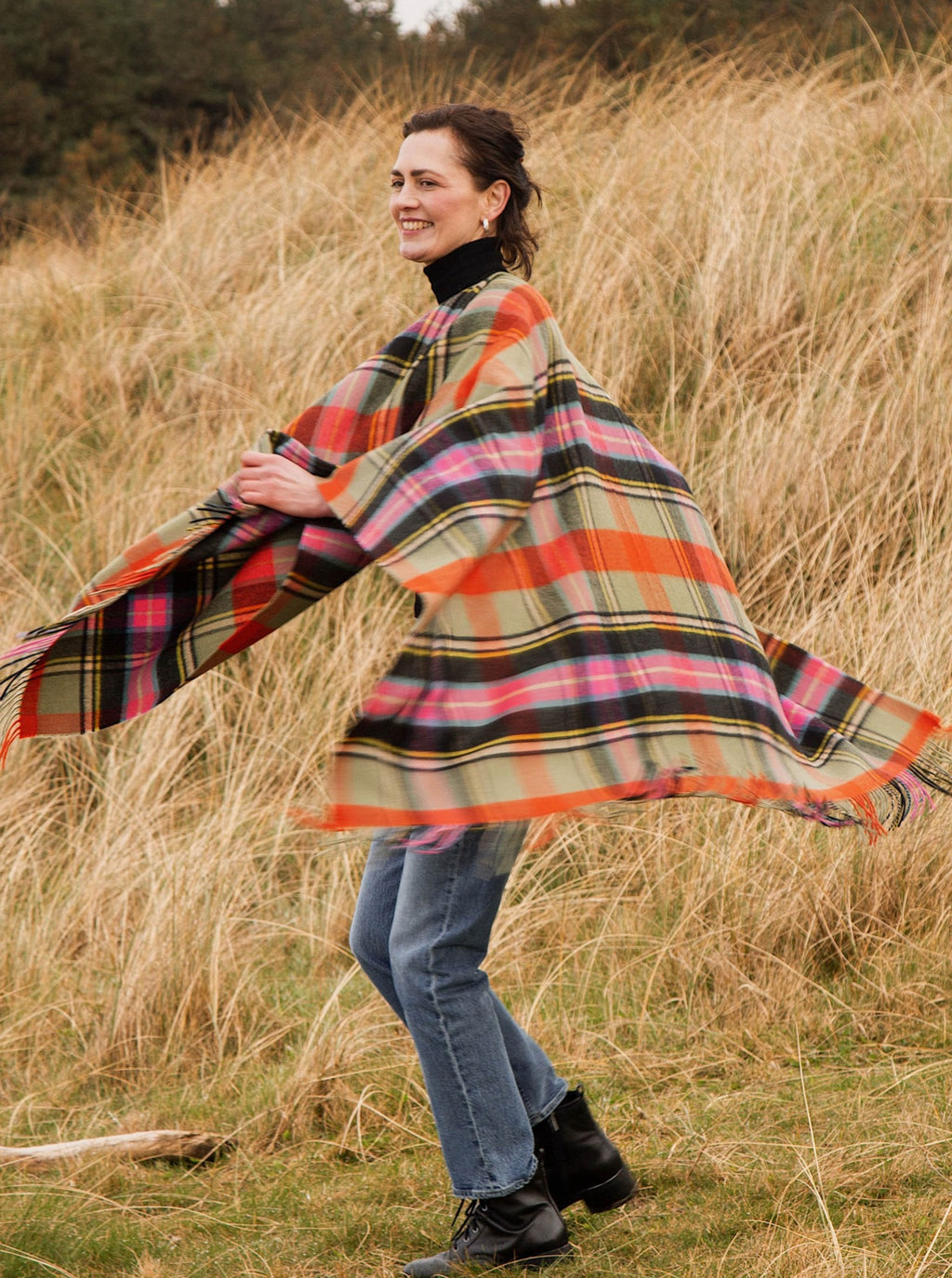 Wool serape in Bruce of Kinnaird tartan, shown on model.