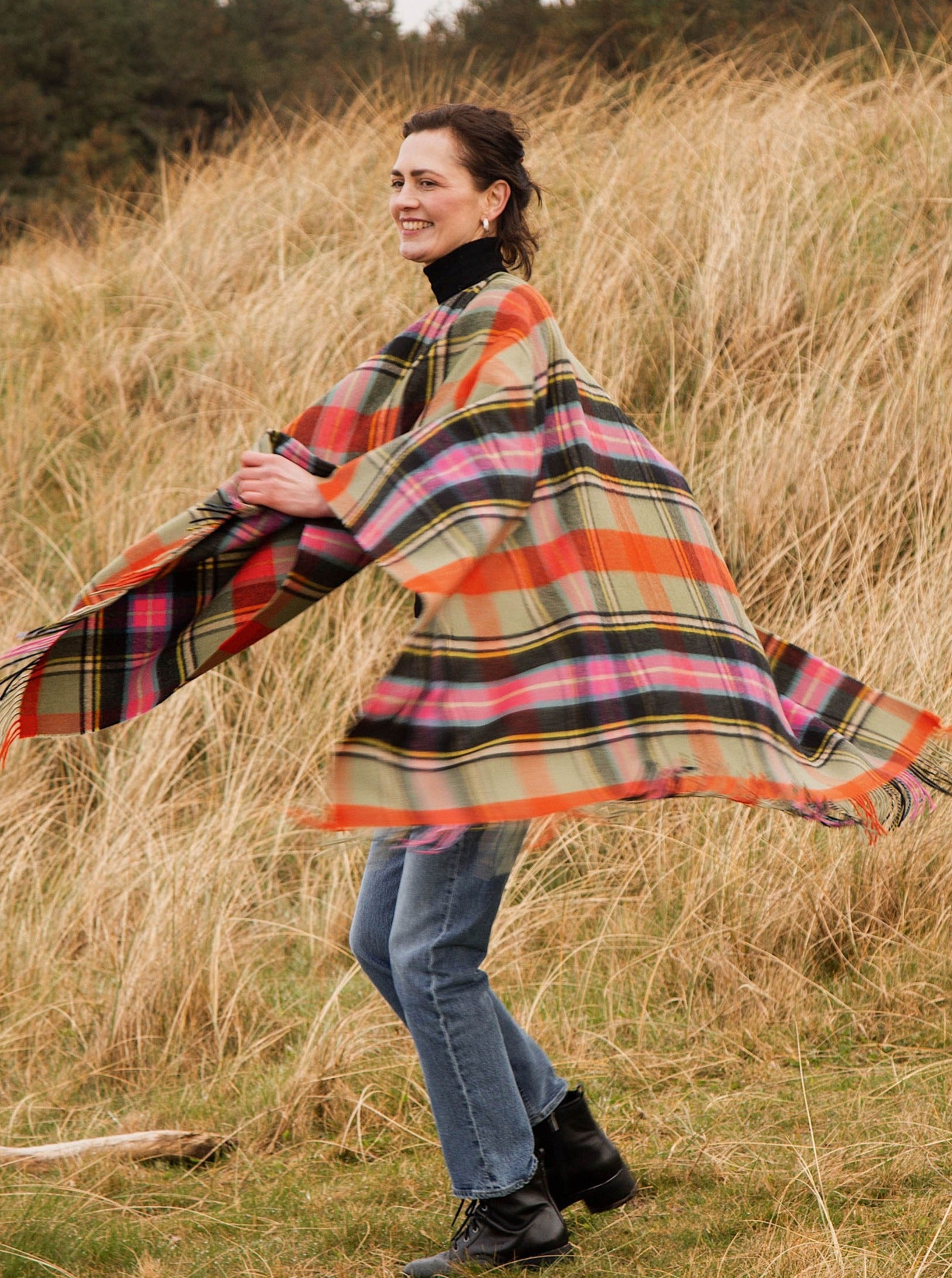 Wool serape in Bruce of Kinnaird tartan, shown on model.