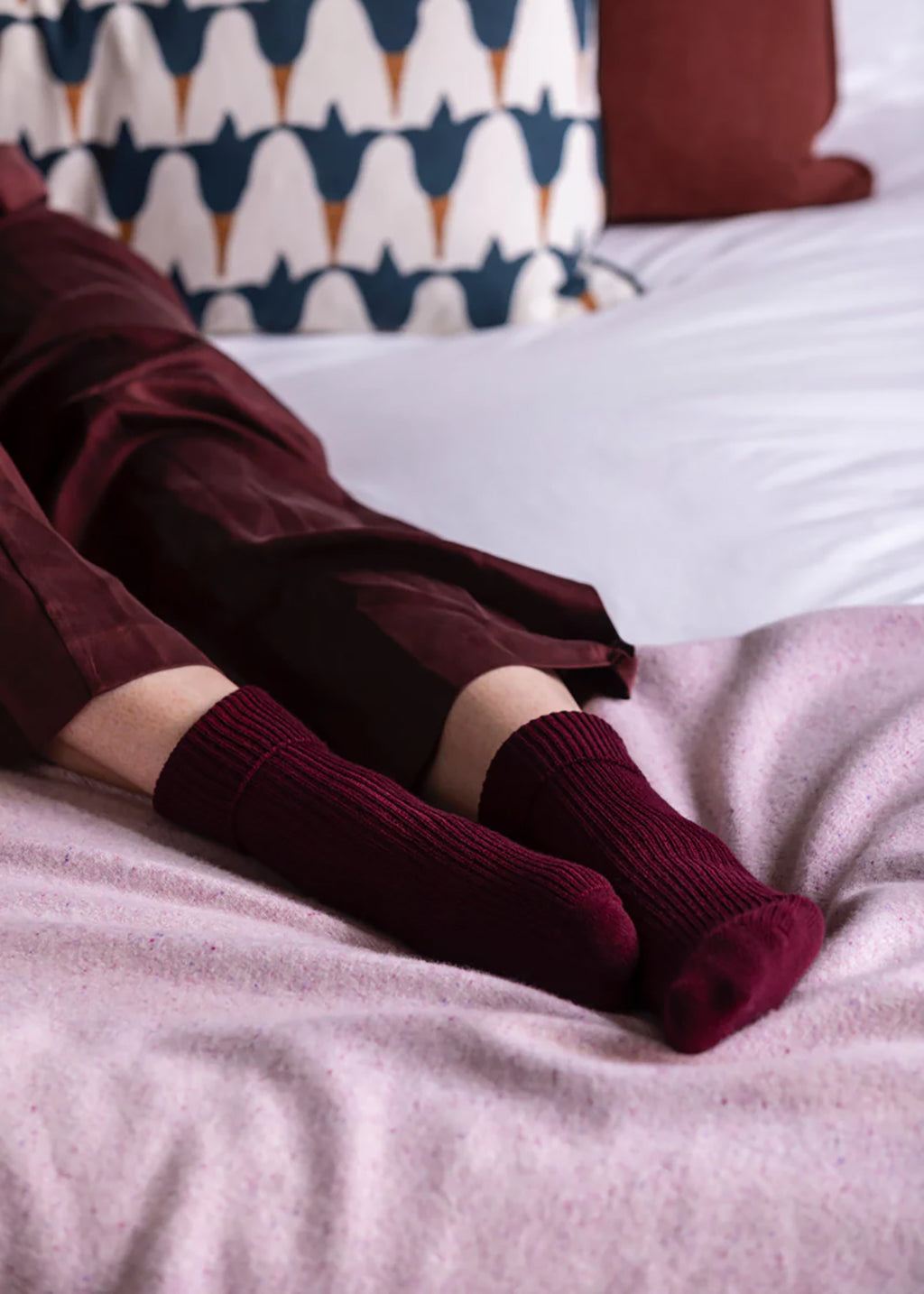 Cashmere bed socks in deep damson red.