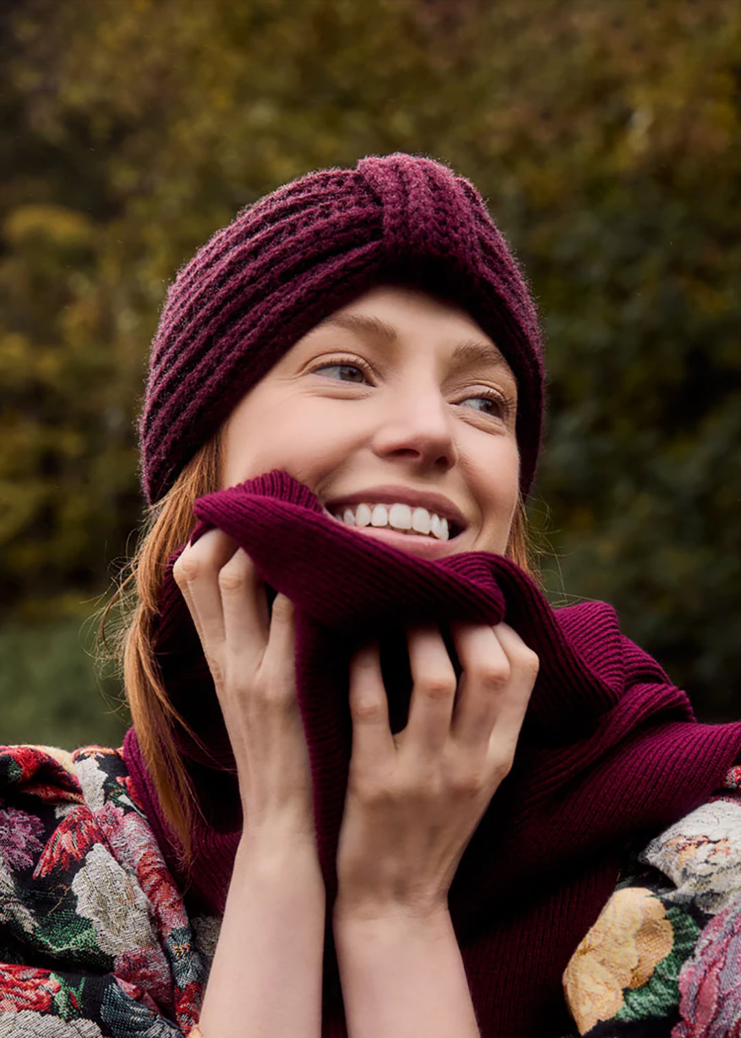 Chunky cashmere ear warmer in deep damson red.
