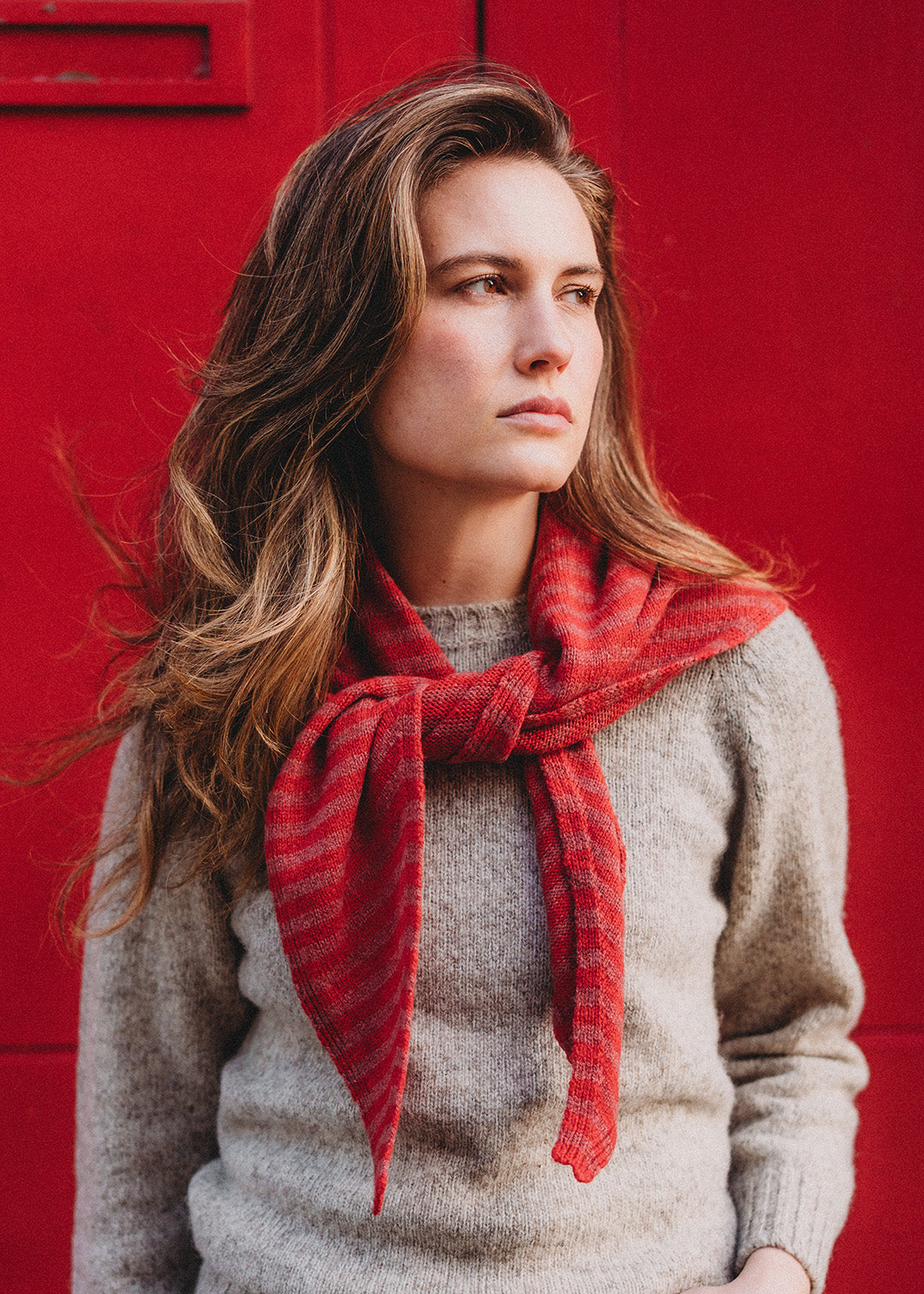 Knitted lambswool triangle scarf in cinder stripe.