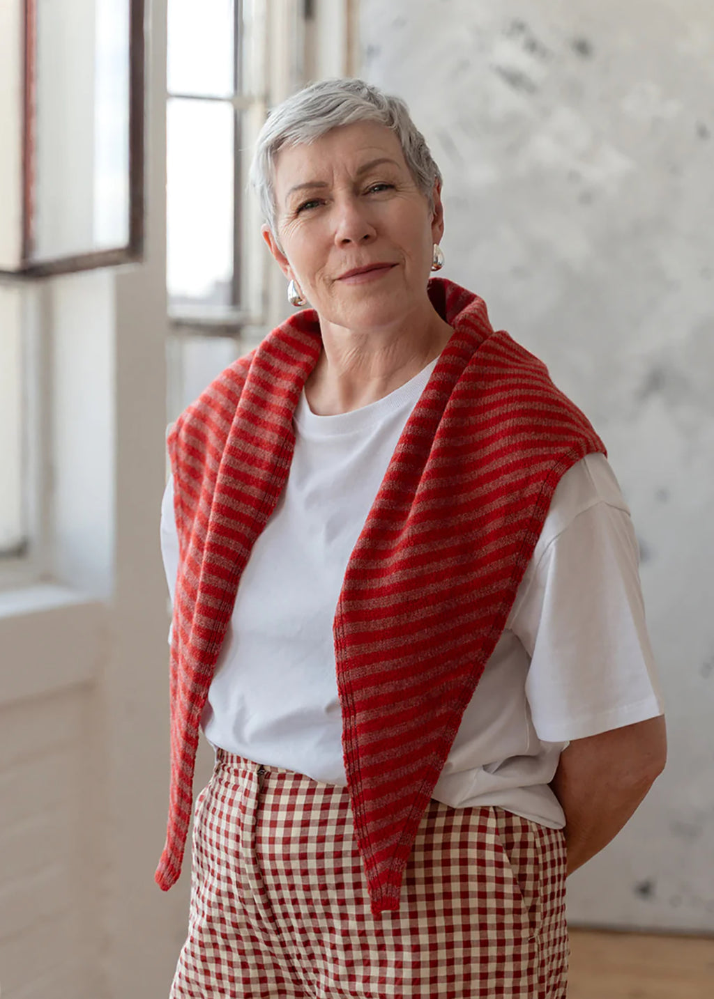 Knitted lambswool triangle scarf in cinder stripe.