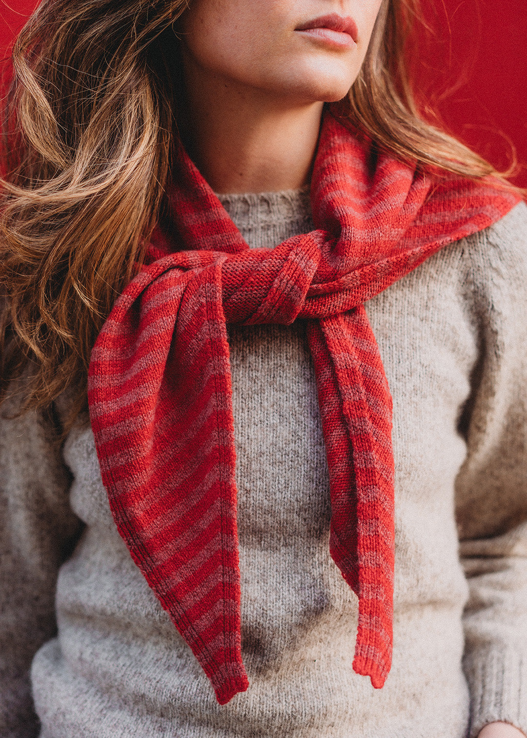Knitted lambswool triangle scarf in cinder stripe.