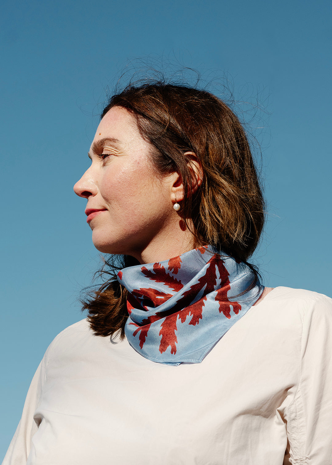 The Drift silk scarf features a collaged print of seaweeds found on the coastline of the Isle of Mull.
