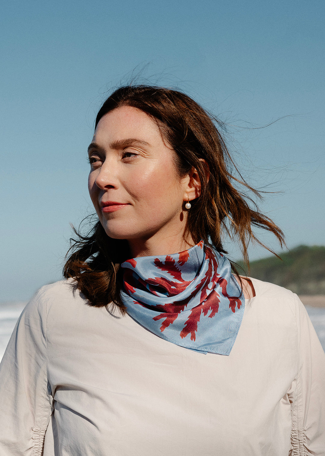 The Drift silk scarf features a collaged print of seaweeds found on the coastline of the Isle of Mull.