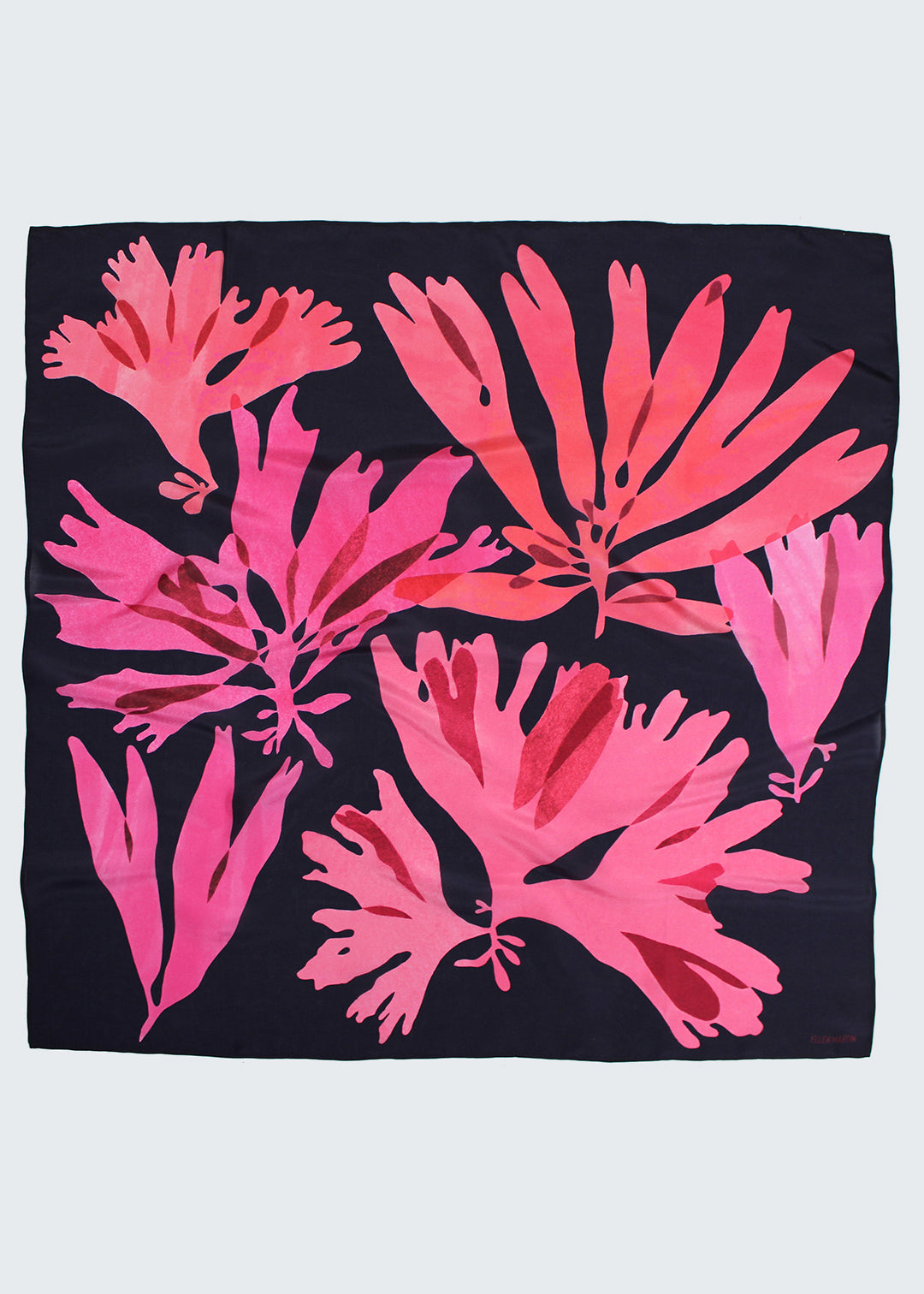 The Dulse silk scarf features a collaged print of dulse seaweed in vibrant pinks on a dark navy background.