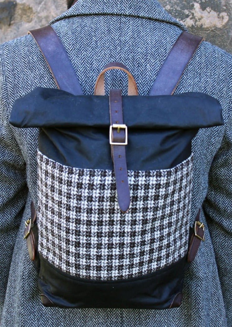 Harris Tweed in brown and white small check and Waxed Cotton Canvas backpack with black leather trim. Scottish Textiles Showcase.