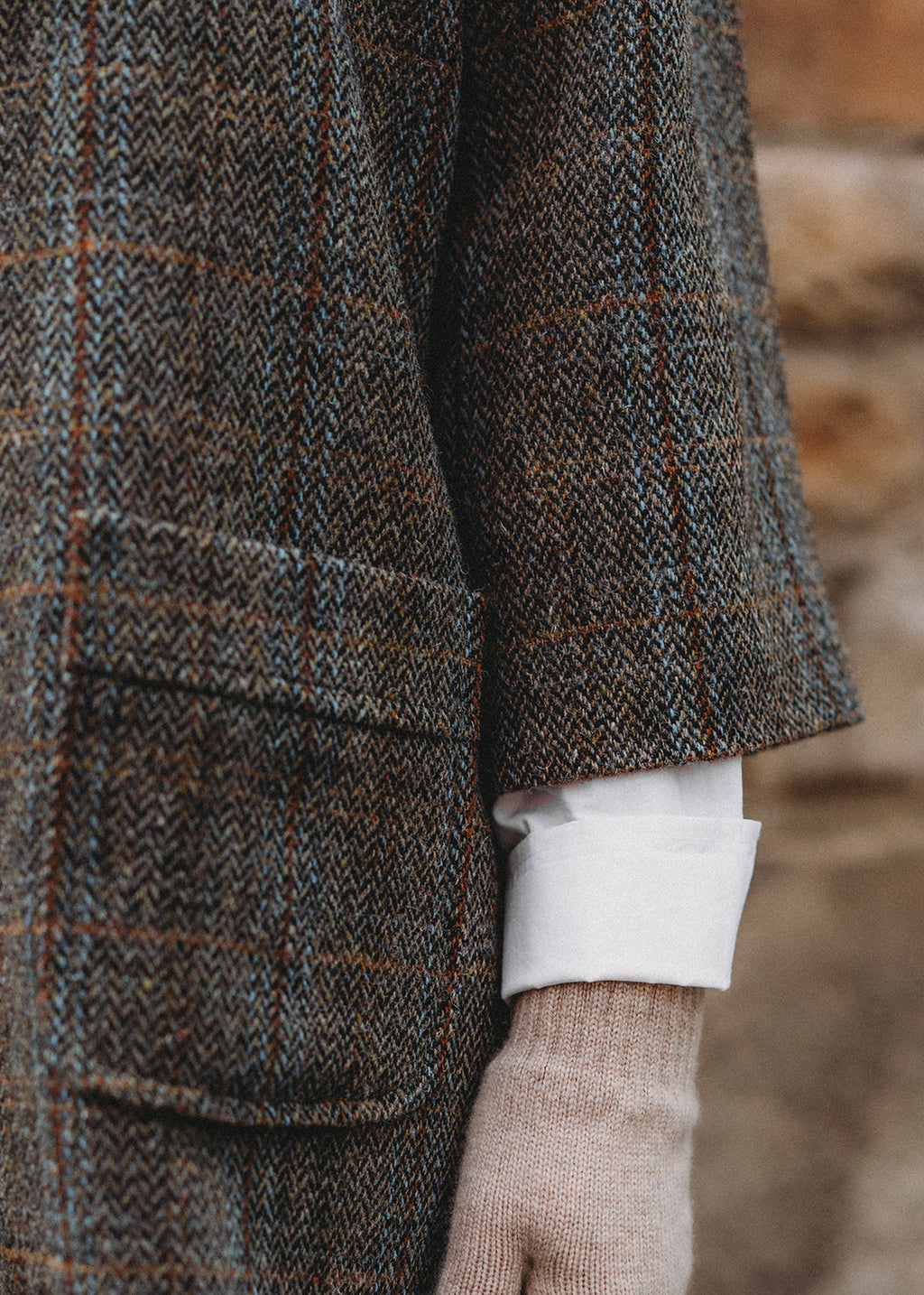 Pure wool Harris Tweed coat in a brown herringbone check.
