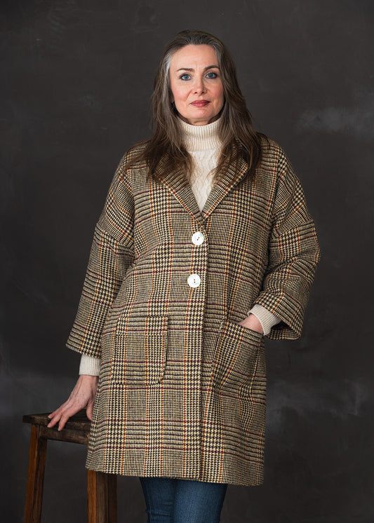 Harris Tweed ladies' coat in a camel and burgundy check with shell buttons and cropped sleeves.