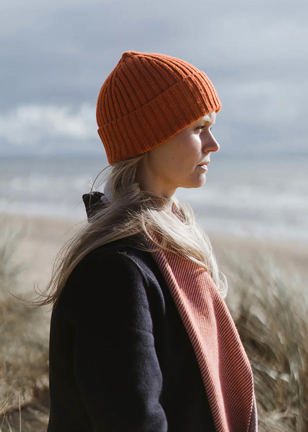 Ribbed knit beanie hat in deep orange Furnace colour. Scottish Textiles Showcase.