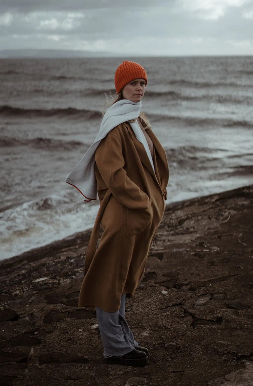 Ribbed knit beanie hat in deep orange Furnace colour. Scottish Textiles Showcase.