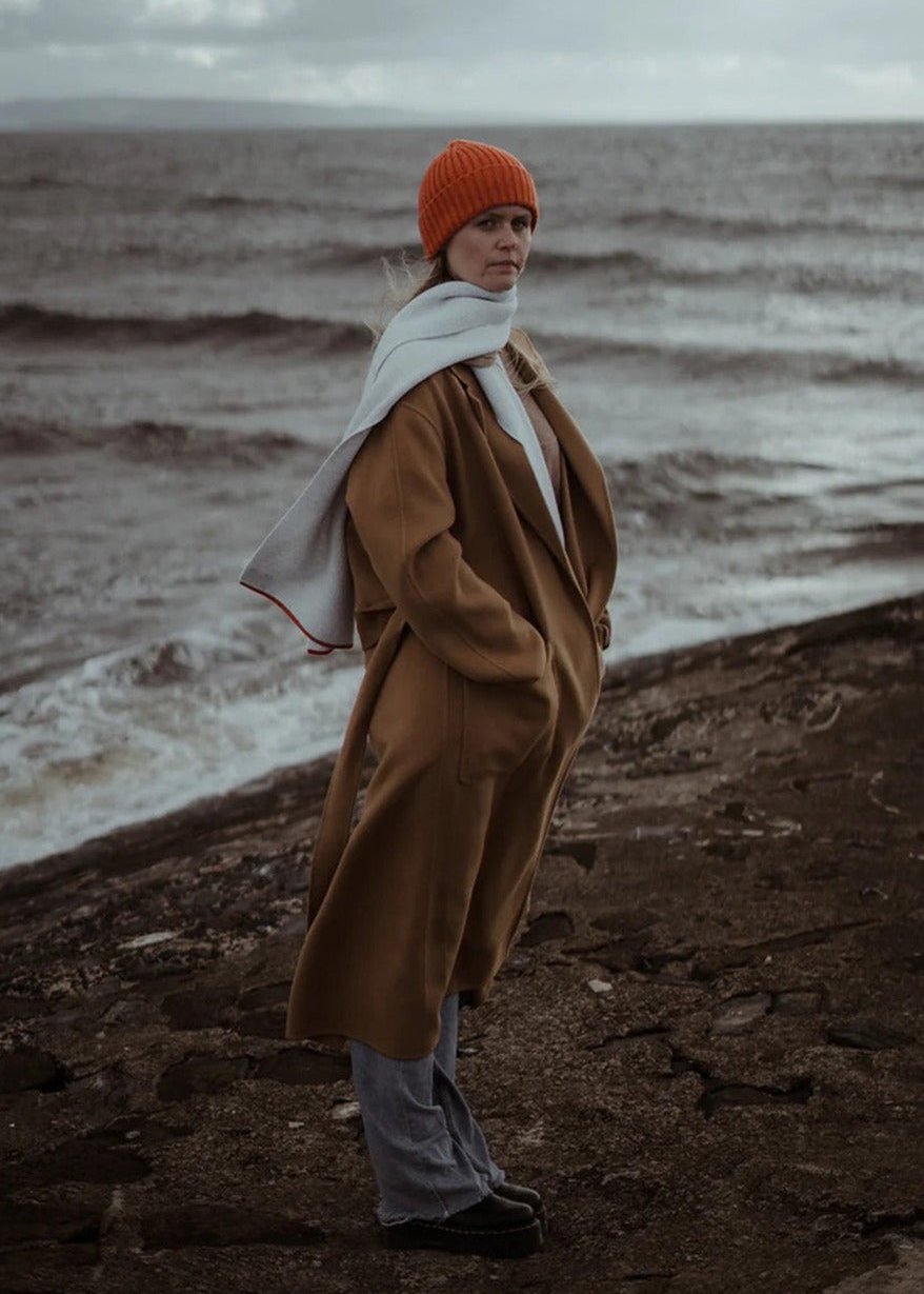 Ribbed knit beanie hat in deep orange Furnace colour. Scottish Textiles Showcase.