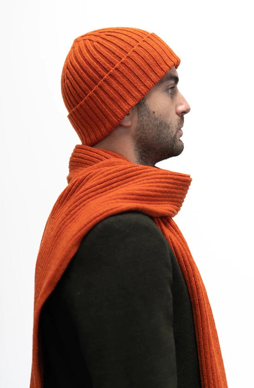 Ribbed knit beanie hat in deep orange Furnace colour. Scottish Textiles Showcase.