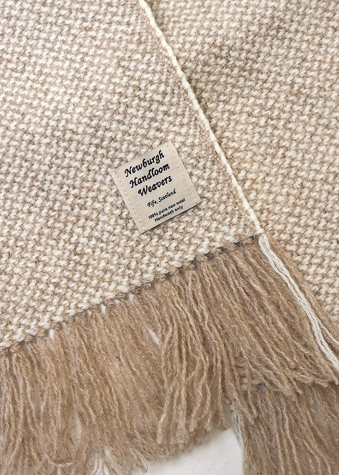 Handwoven, British wool scarf in natural, un-dyed shades.