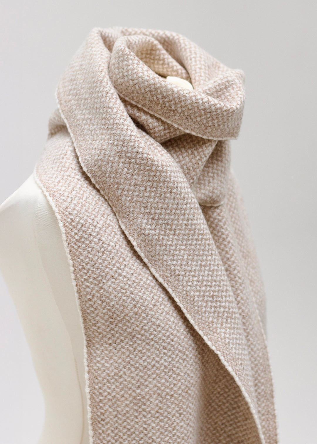 Handwoven, British wool scarf in natural, un-dyed shades.