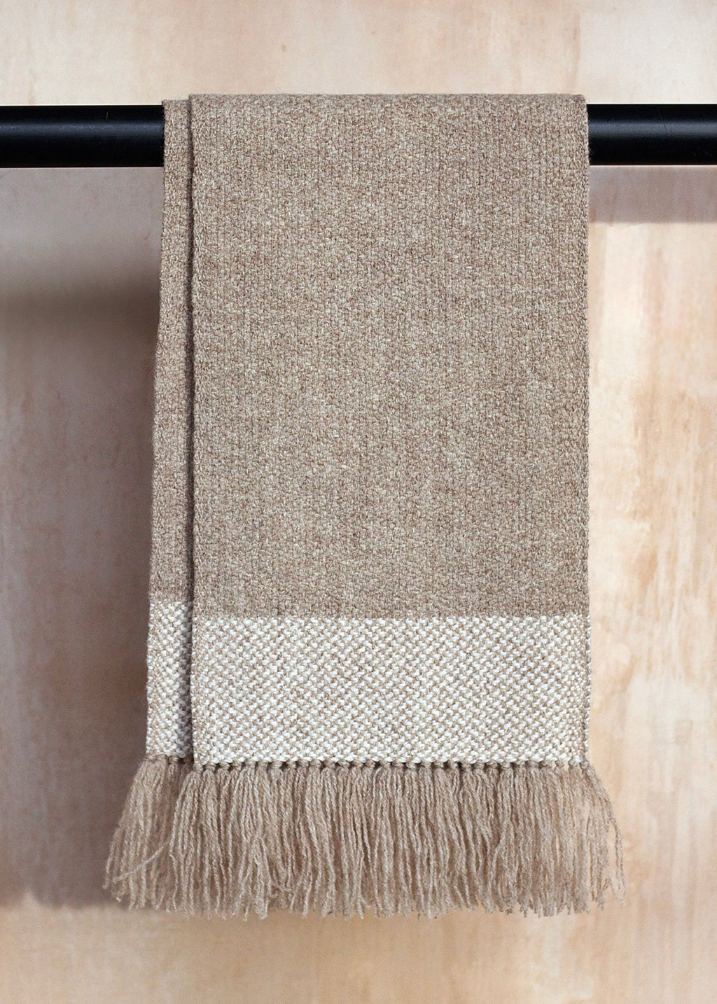 Handwoven, British wool scarf in natural, un-dyed shades.