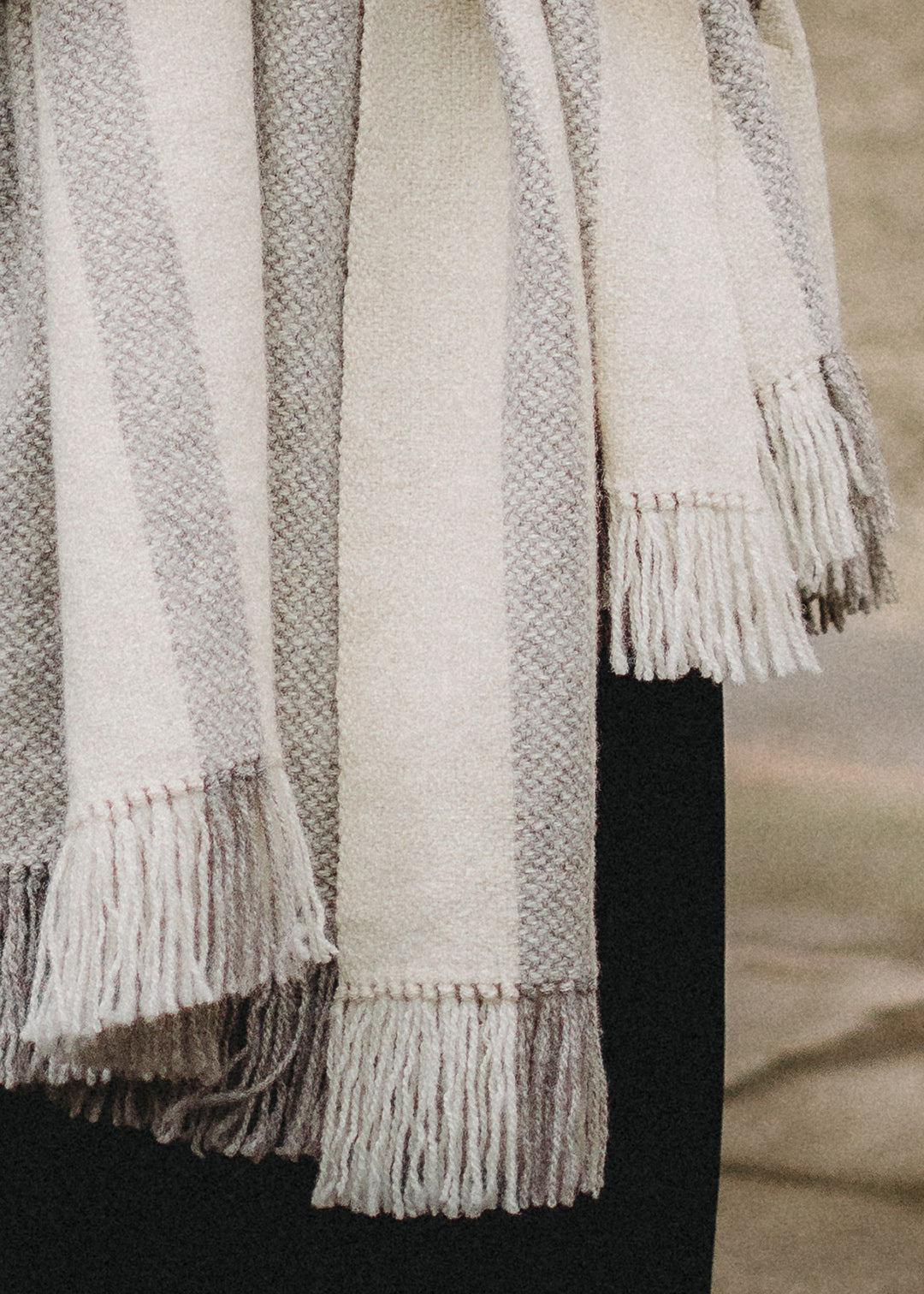 Handwoven Falkland Estate blanket in natural grey and off white.