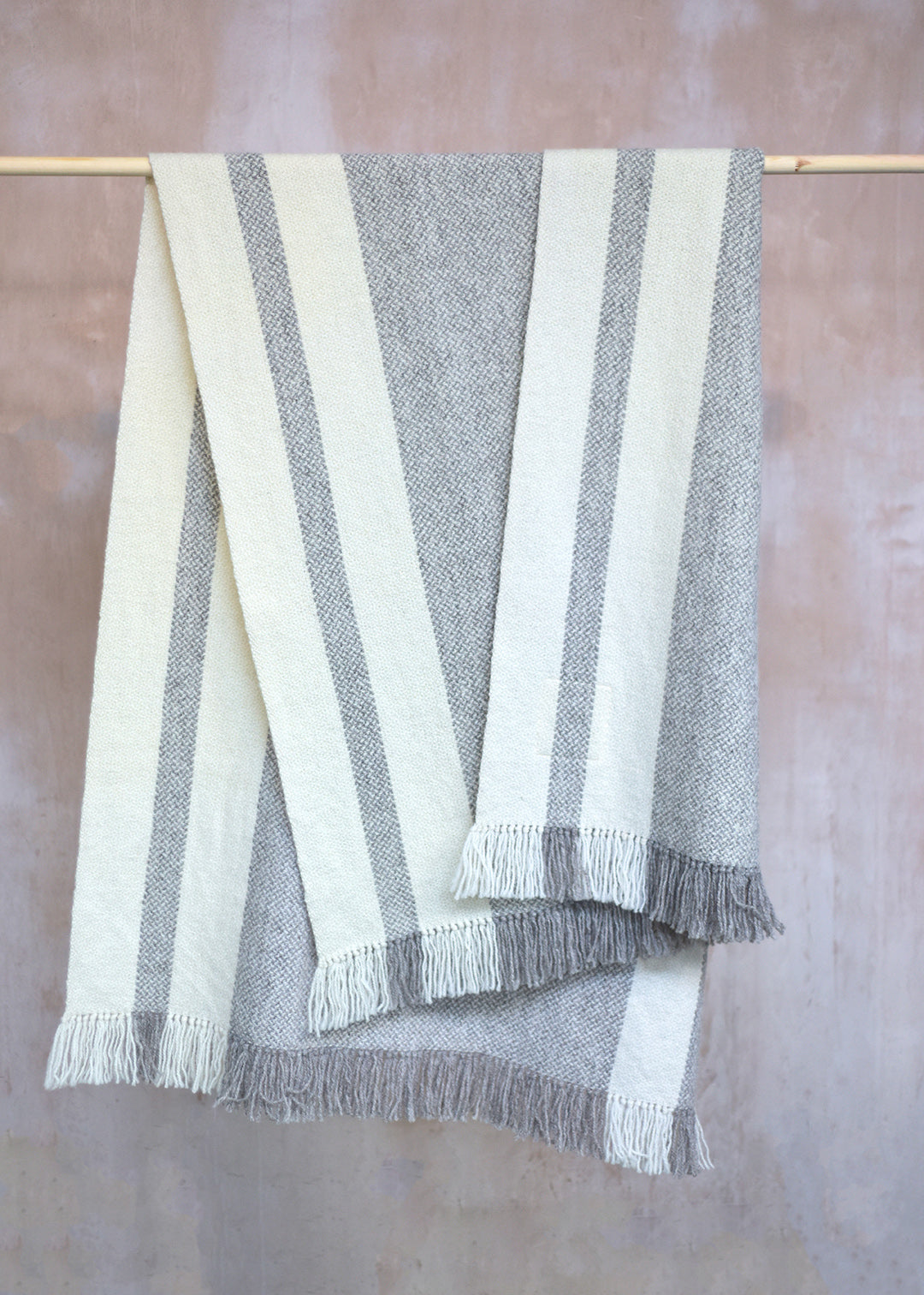 Handwoven Falkland Estate blanket in natural grey and off white.