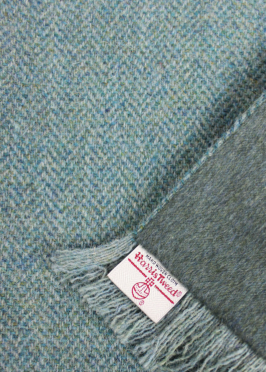 Harris Tweed and cashmere scarf in ocean blue with a subtle herringbone pattern.