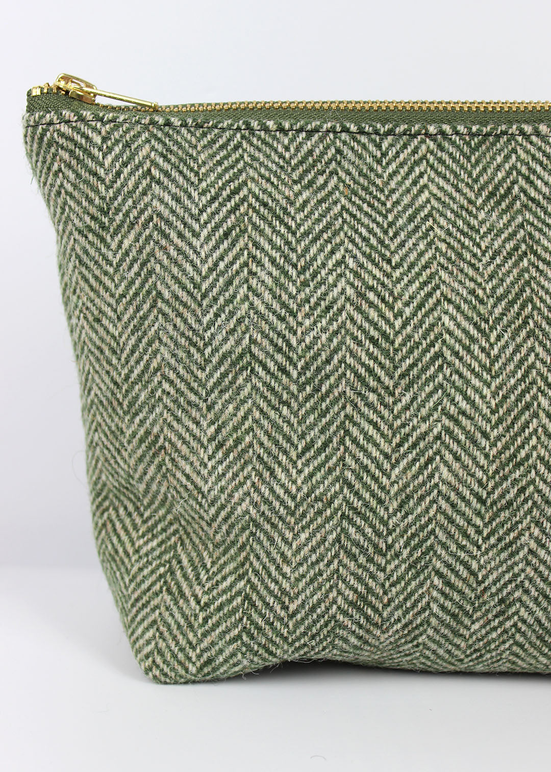 Harris Tweed cosmetic bag in green herringbone.