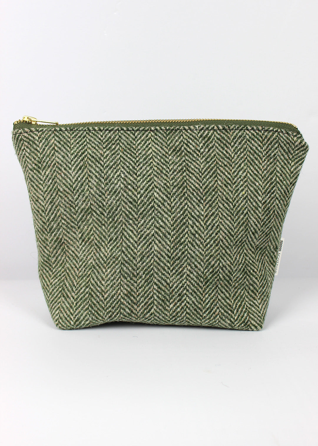 Harris Tweed cosmetic bag in green herringbone.