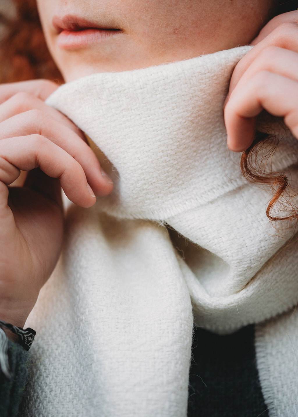 Alpaca scarf close up in white.