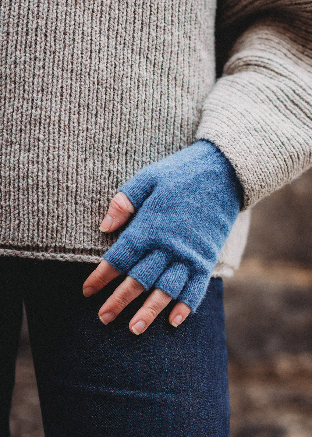 Ladies' lambswool fingerless gloves in mid blue.