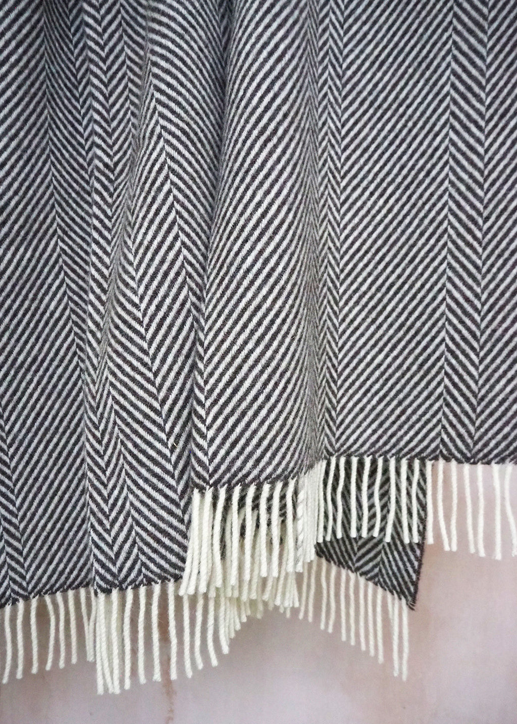 Brown and cream herringbone blanket woven in natural, un-dyed Scottish wool.