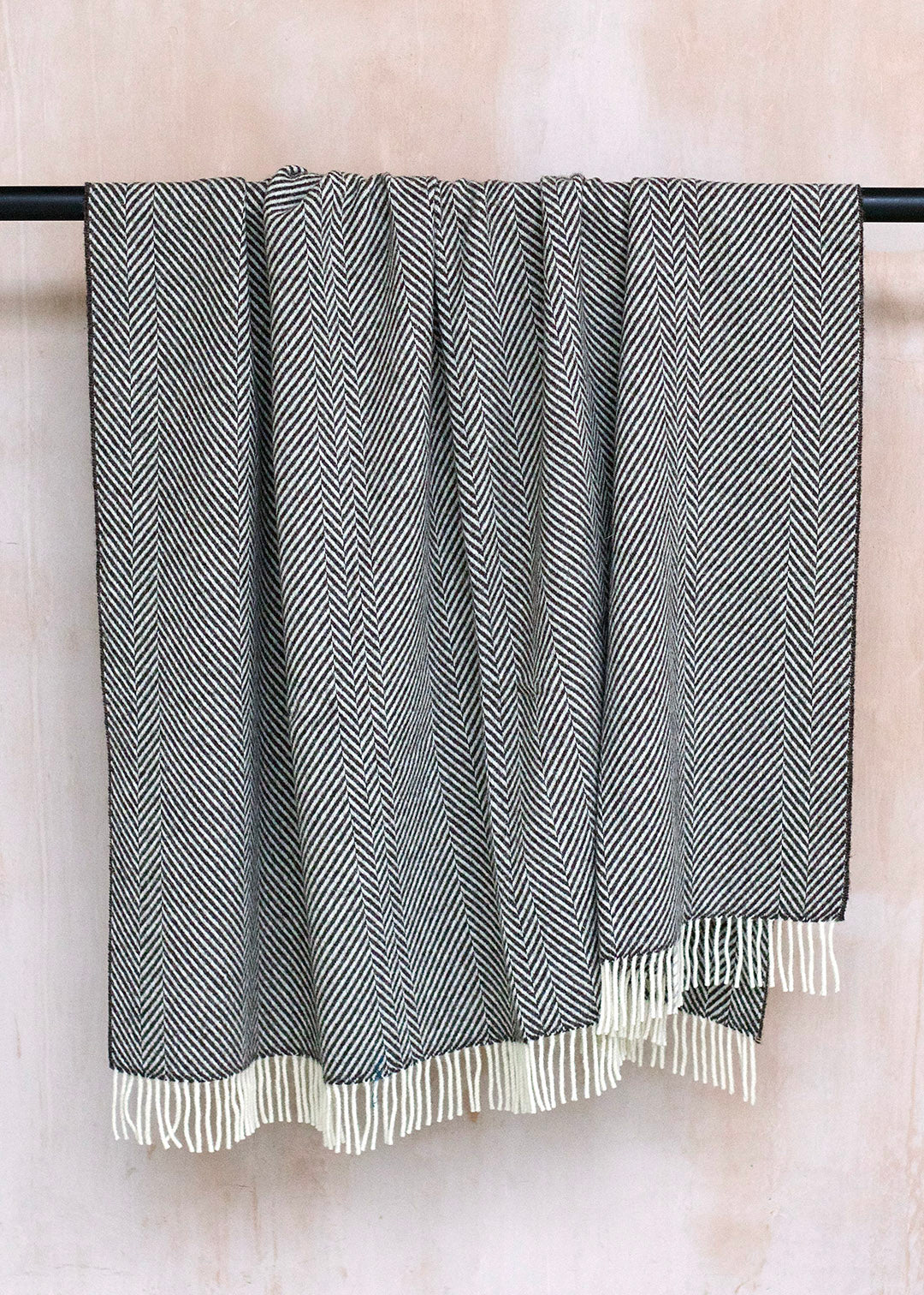 Brown and cream herringbone blanket woven in natural, un-dyed Scottish wool.