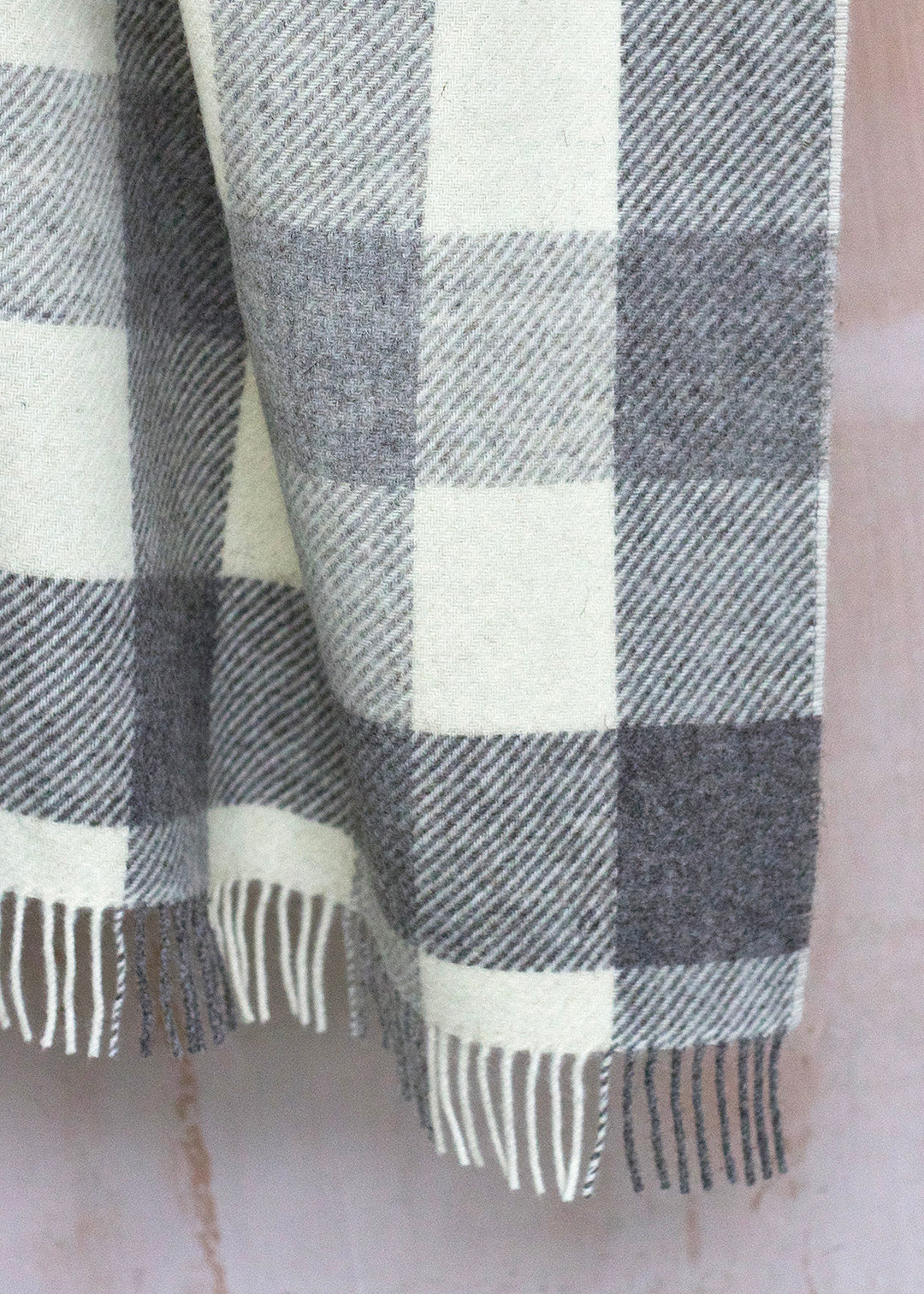 Grey, cream and brown checked blanket woven in natural, un-dyed Scottish wool.