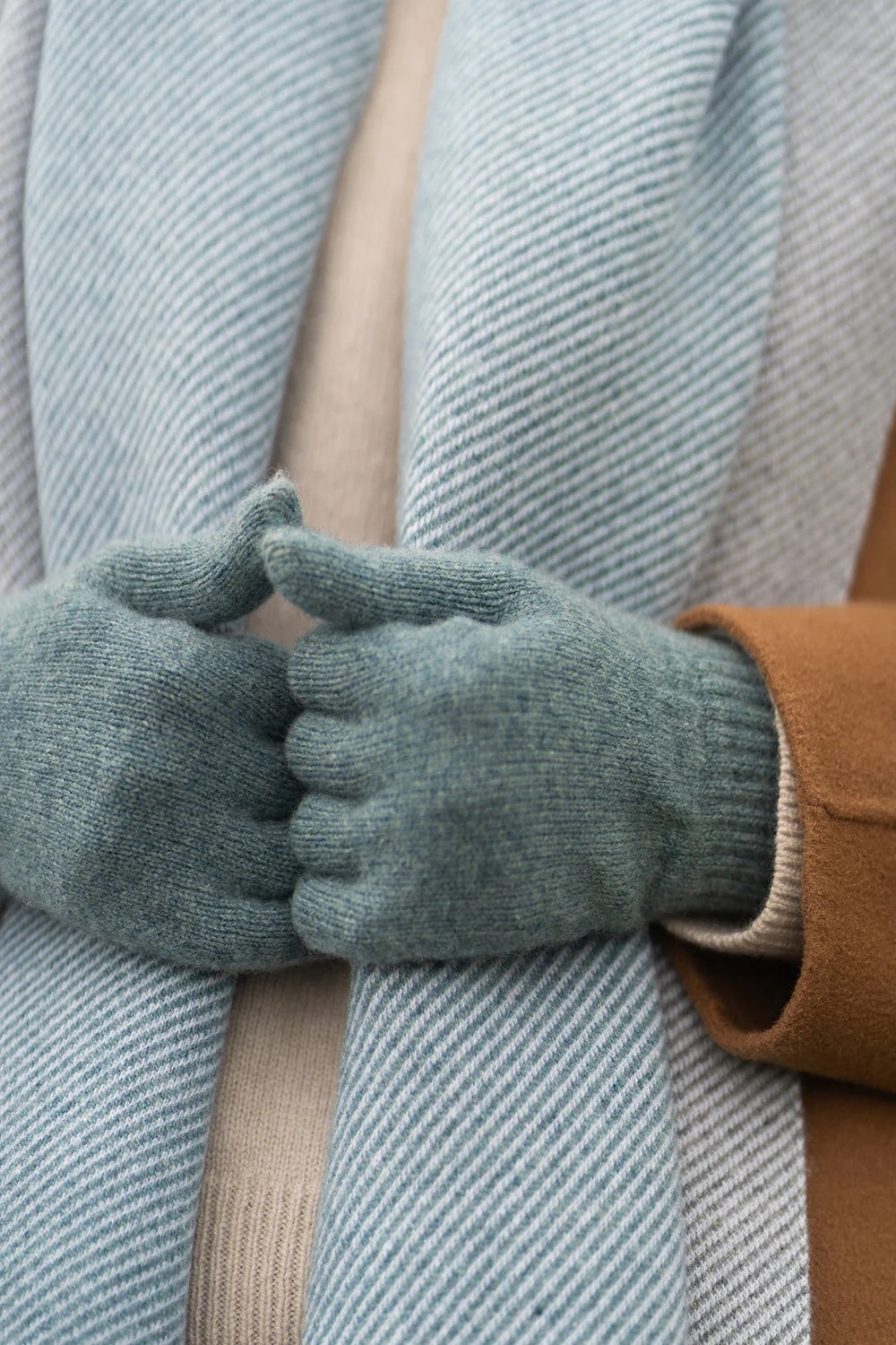 Lambswool gloves in blue oribe colour. Scottish Textiles Showcase.
