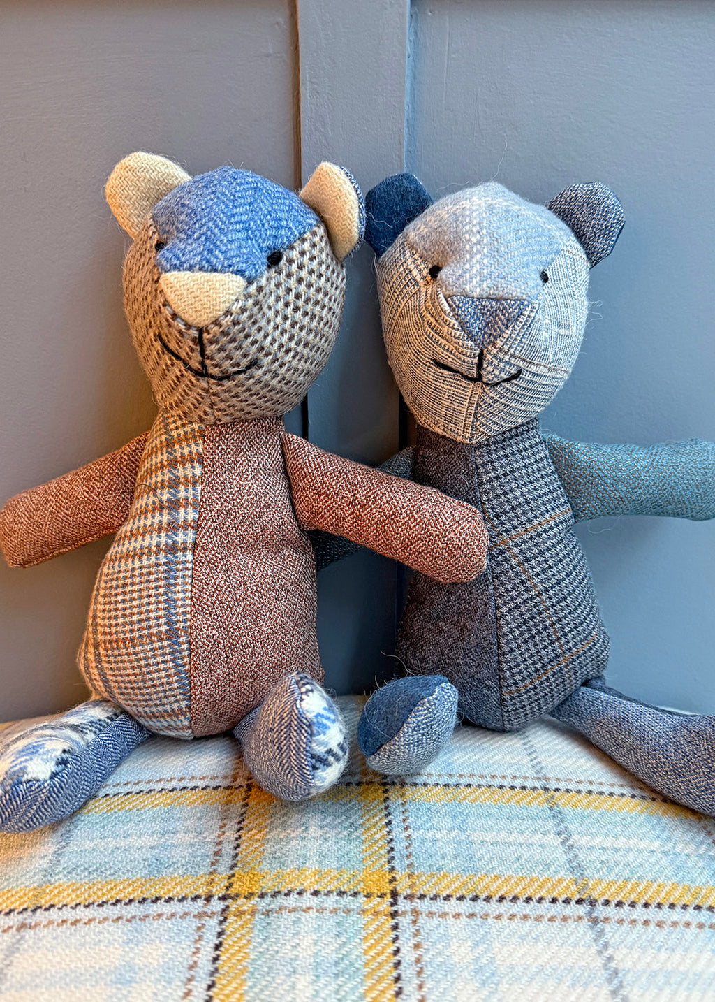 Unique patchwork tweed bear with different patterns and colours in shades of blue paired with natural tones.