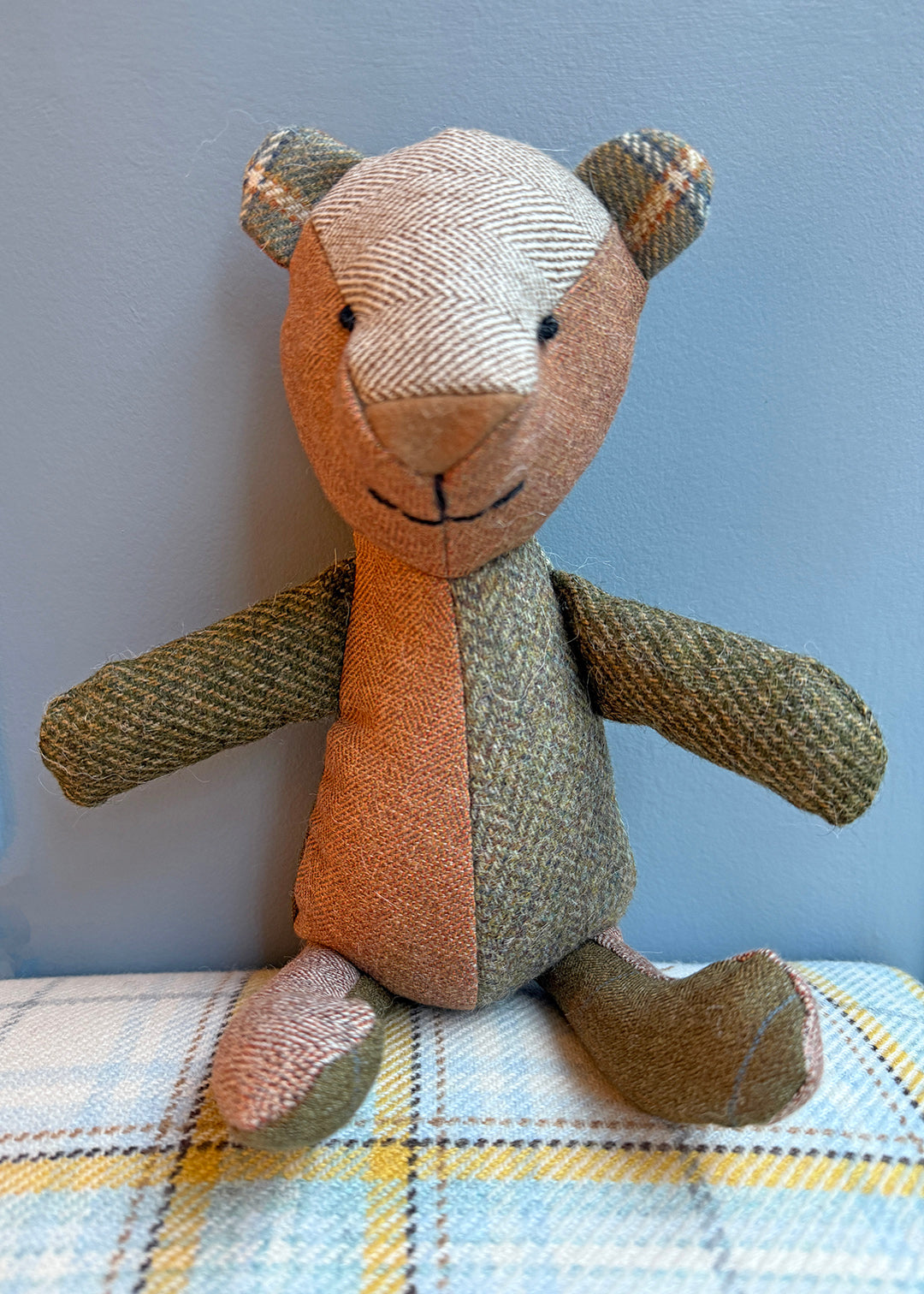 Unique patchwork tweed bear with different patterns and colours in shades of green tweed paired with natural tones.
